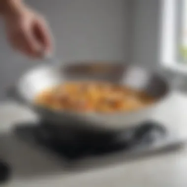 Effortless Food Lifting with the Slotted Turner The All Clad flexible slotted turner in action, effortlessly lifting food from a pan.