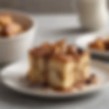 A slice of bread pudding served on a plate with a sprinkle of cinnamon