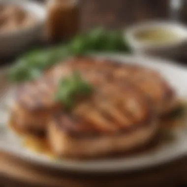 Plated grilled pork chops garnished with herbs and sides