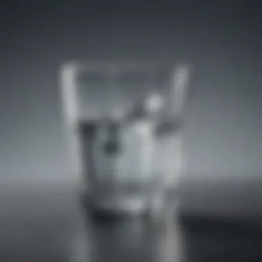 Close-up view of a glass cup filled with crystal-clear water, highlighting the clarity and purity of the beverage.