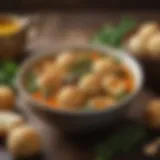 A bowl of rich broth with matzo balls and herbs