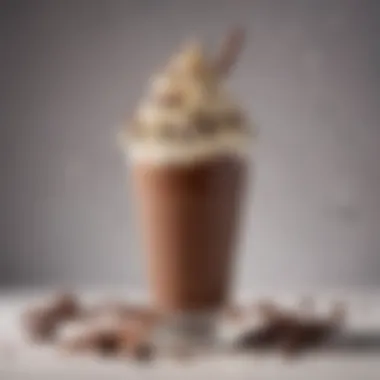 A rich chocolate milkshake with whipped cream and chocolate shavings