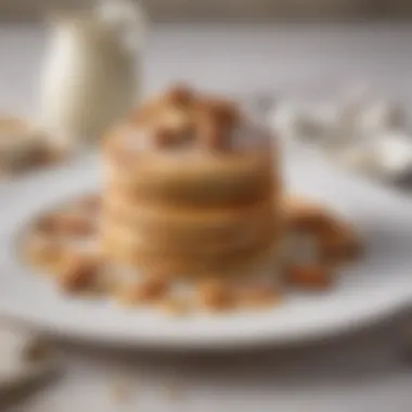 Elegant Presentation of Almond Flour Pancakes An elegant plate of almond flour pancakes garnished with nuts and a dusting of powdered sugar