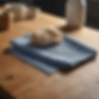 A close-up of a dish cloth being laid out flat on a surface, emphasizing drying techniques