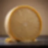 Artisanal wheel of Parmesan cheese showcasing its distinct texture and color.