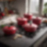 Cerise Le Creuset cookware set showcased in a contemporary kitchen setting