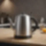 A sleek small electric hot water teapot on a kitchen countertop