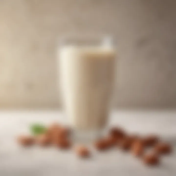 Close-up of almond milk in a glass with almonds