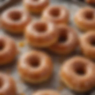 A plate of doughnut crullers drizzled with a luscious glaze, showcasing their decadent appeal.