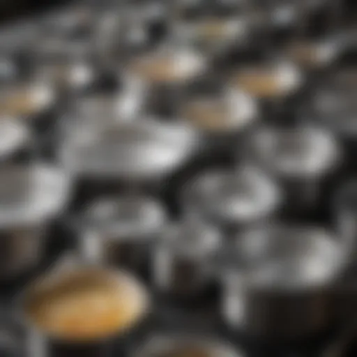 Glistening stainless steel pots arranged neatly