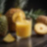 A vibrant glass of pineapple juice surrounded by fresh pineapples