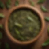 A variety of green tea leaves in an elegant wooden bowl showcasing the diversity of flavors.