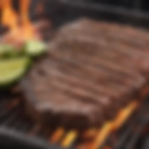 Sizzling carne asada on a charcoal grill