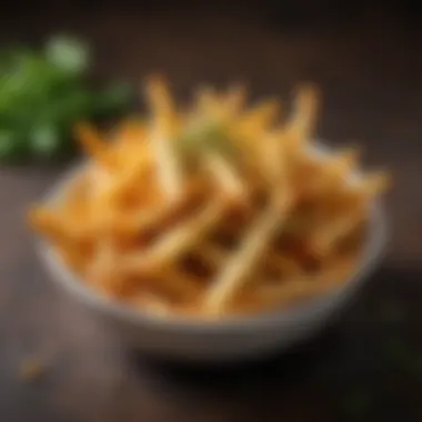 Golden crispy air-fried fries in a bowl garnished with herbs