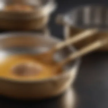 A close-up of seasoned stainless steel cookware with a golden hue, indicating effective seasoning.