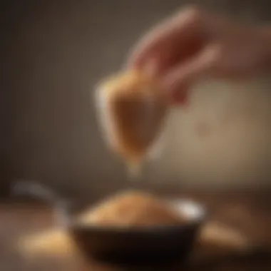 A hand holding a measuring cup filled with brown rice