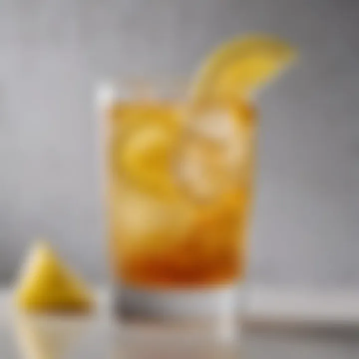 Refreshing spiked Arnold Palmer in a clear glass with ice and a lemon slice