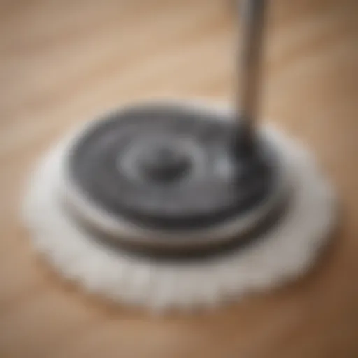 Close-up view of a swirl mop with a foot pedal mechanism