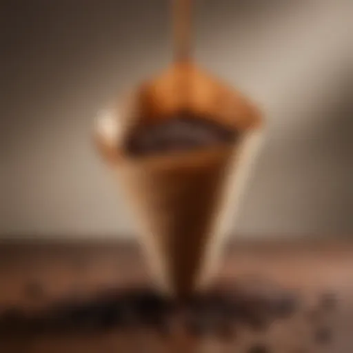 Close-up of a single cup drip coffee cone with coffee grounds