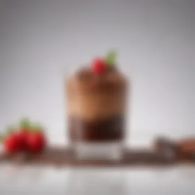 A close-up of a decadent chocolate mousse served in a small glass.