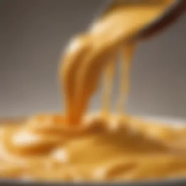 A close-up view of the velvety texture of the nacho cheese sauce, showcasing its smooth consistency.