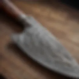 Close-up view of a handcrafted Damascus chef knife showcasing intricate patterns.