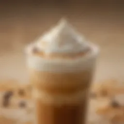 A close-up of a chilled iced latte with a frothy layer on top, showcasing its rich color and texture.